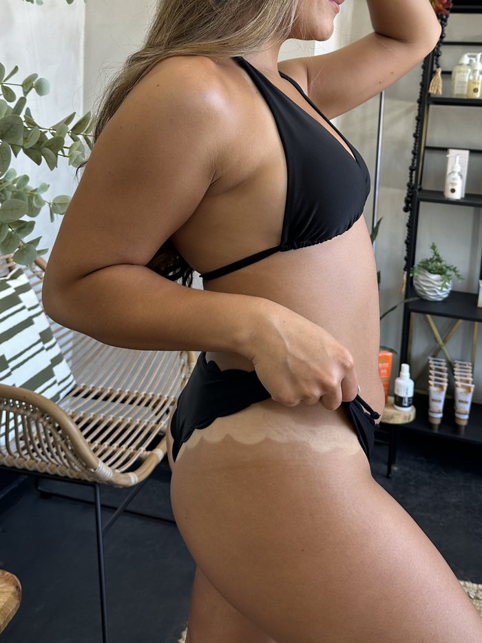 Full body spray tan result, side view